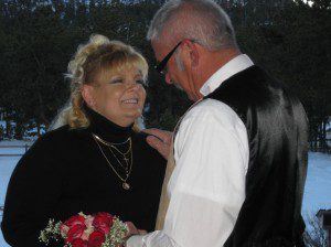 Dude ranch Elope - Kim and Gale Gale is stepping on Kim's toe at their dude ranch elopement wedding