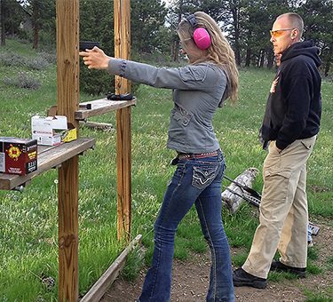 A guest prepares to take a shot at the shooting range.